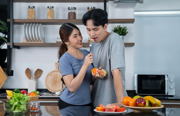 asian couple at kitchen