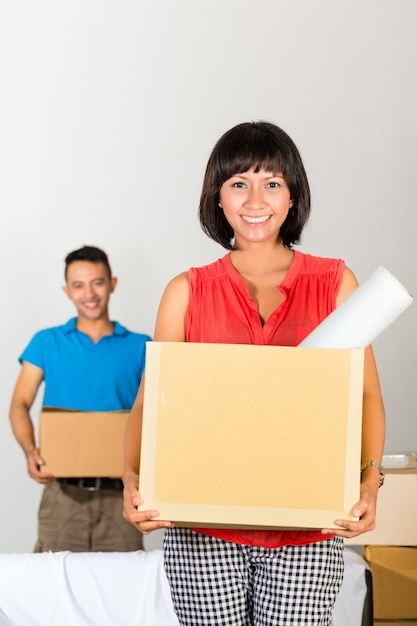 Asian couple moving in the new home