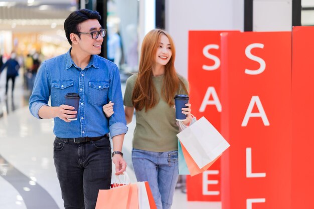 Asian couple shopping at the mall