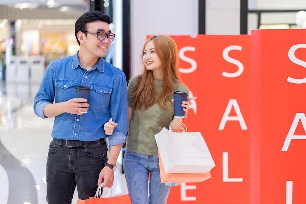 Asian couple shopping at the mall