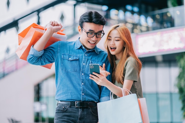 Asian couple shopping at the mall