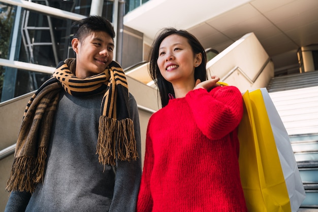 Asian couple shopping in the mall.