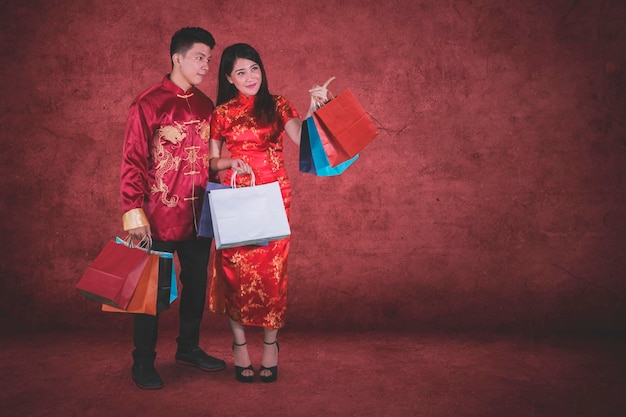 Asian couple with bags at Chinese new year