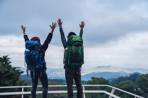 Asian couples travel nature on the mountains in winter.Travel relax. Natural touch countryside at doi inthanon in Thailand.