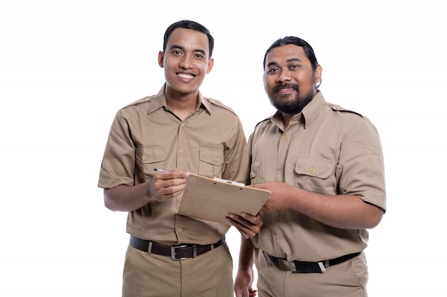 Asian coworkers wearing khaki uniforms