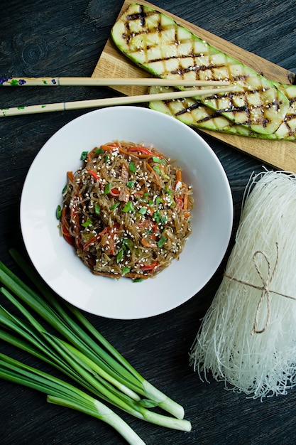 Asian cuisine. Cellophane noodles decorated with vegetables