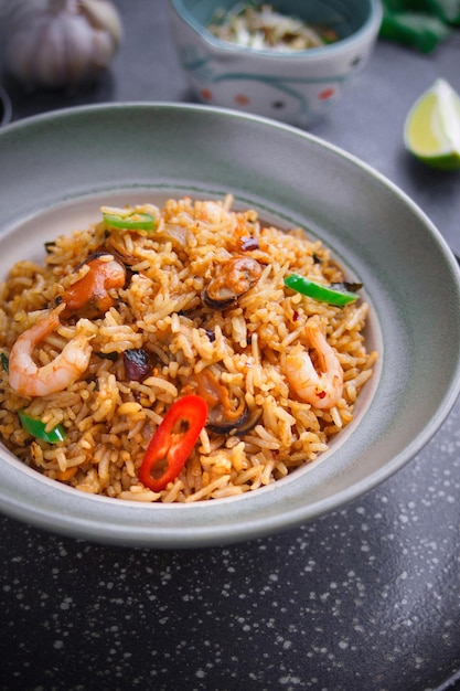 Asian Cuisine,  Nasi goreng, Seafood rice on dark