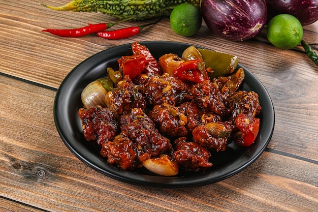 Asian cuisine pork with chili sauce and vegetables