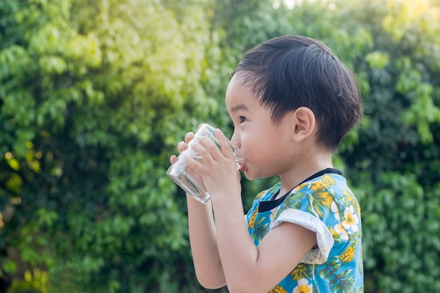 Asian Cute Boy drinking water for Healthy 