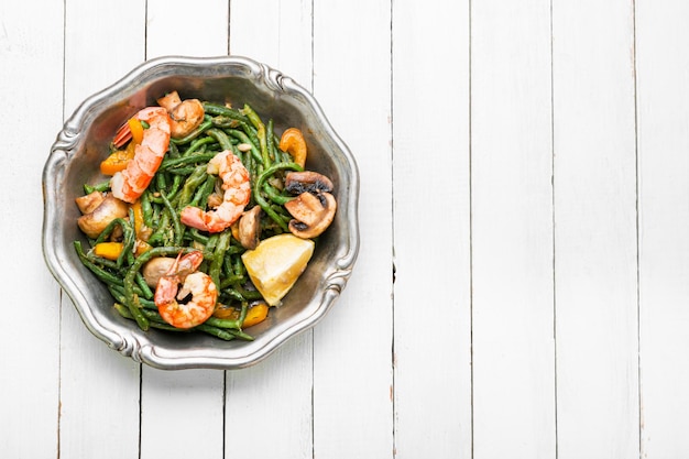 Asian delicious salad with shrimp asparagus beans and okra Copy space