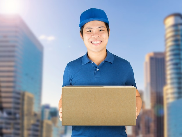 asian delivery man holding carton box