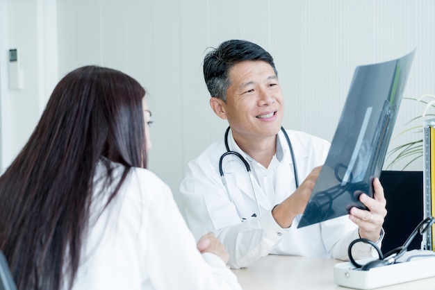 Asian doctor and patient are discussing