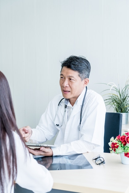 Asian doctor and patient are discussing