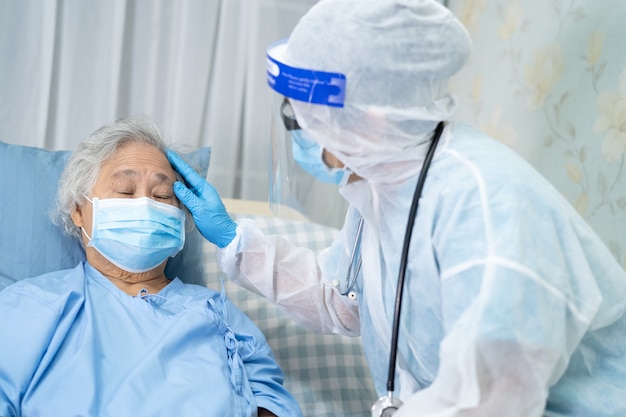 Asian doctor wearing face shield and ppe suit