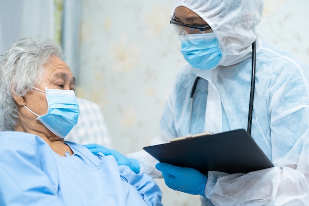 Asian doctor wearing PPE suit to protect Covid-19 Coronavirus.