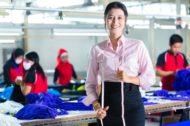 Asian dressmaker in a textile factory