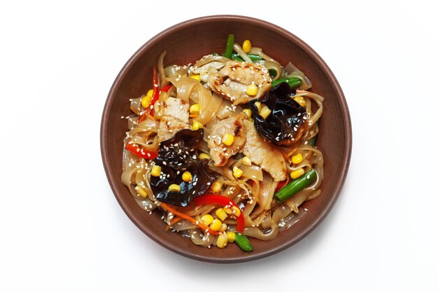 Asian egg noodles with vegetables mushrooms green onions and chicken