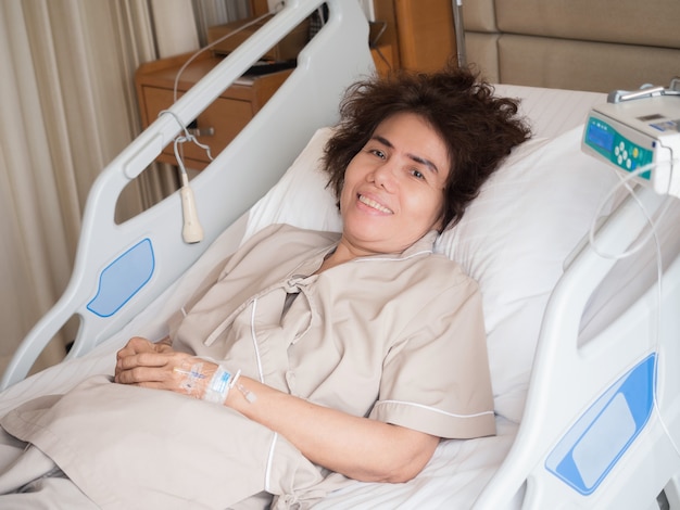 Asian elderly patient lying on bed in hospital