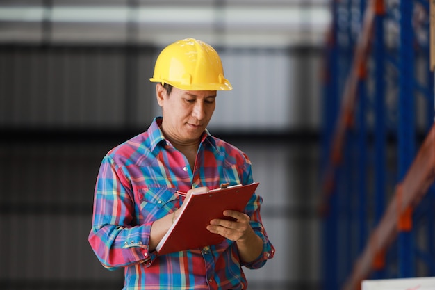 Asian Engineer man working in building factory