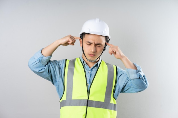 Asian engineer portrait on gray background