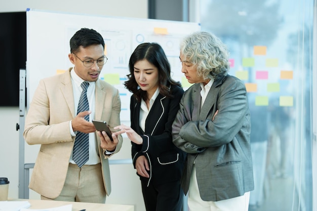 Asian entrepreneurs and business people meeting in a conference
room in business planning financial budget and investment risk
assessment to analyze customer groups to increase company
growth