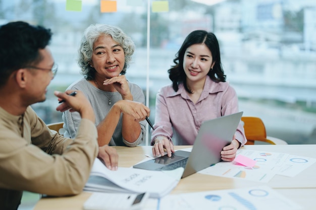 Asian entrepreneurs and business people meeting in a conference\
room in business planning financial budget and investment risk\
assessment to analyze customer groups to increase company\
growth