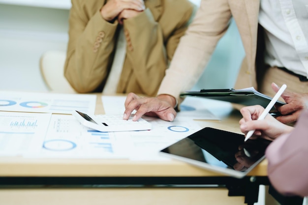 Asian entrepreneurs and business people meeting in a conference
room in business planning financial budget and investment risk
assessment to analyze customer groups to increase company
growth