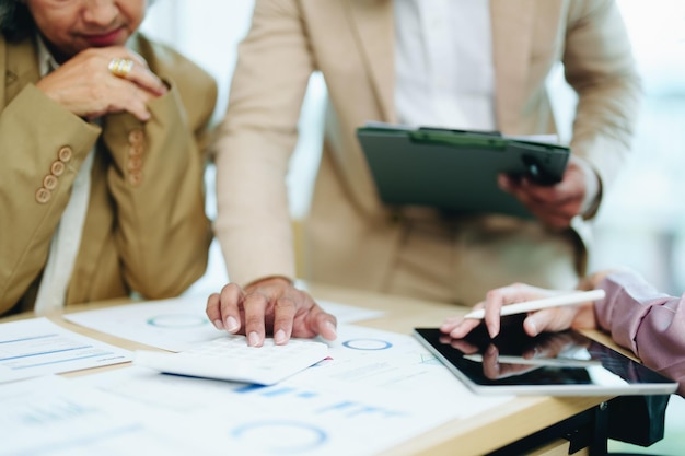 Asian entrepreneurs and business people meeting in a conference room in business planning financial budget and investment risk assessment to analyze customer groups to increase company growth