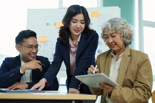 Asian entrepreneurs and business people meeting in a conference\
room in business planning financial budget and investment risk\
assessment to analyze customer groups to increase company\
growth