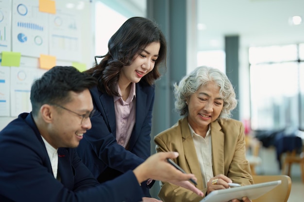 Asian entrepreneurs and business people meeting in a conference\
room in business planning financial budget and investment risk\
assessment to analyze customer groups to increase company\
growth