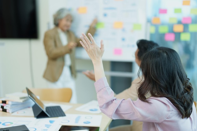 Asian entrepreneurs and business people meeting in a conference
room in business planning financial budget and investment risk
assessment to analyze customer groups to increase company
growth