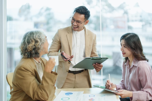 Asian entrepreneurs and business people meeting in a conference\
room in business planning financial budget and investment risk\
assessment to analyze customer groups to increase company\
growth