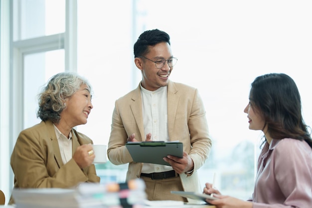 Asian entrepreneurs and business people meeting in a conference\
room in business planning financial budget and investment risk\
assessment to analyze customer groups to increase company\
growth