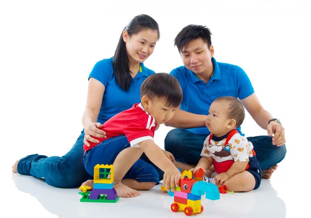 Asian family playing toys