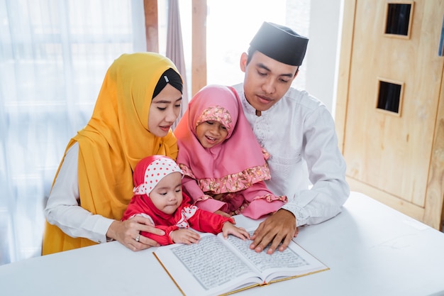 Asian family reading Quran together