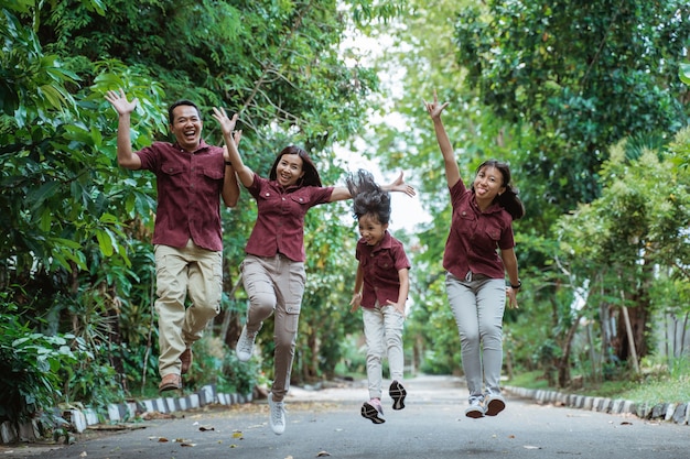 Asian family walking together in the park