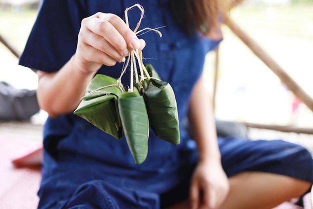 Asian farmer woman hand holding Traditional Thai food