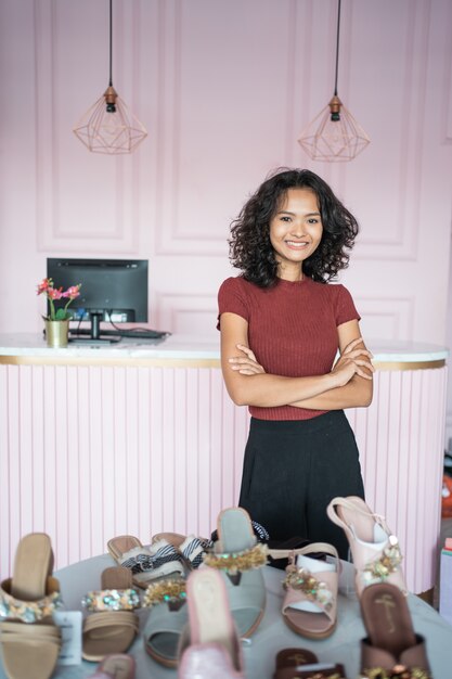 Asian fashion shop owner at her boutique