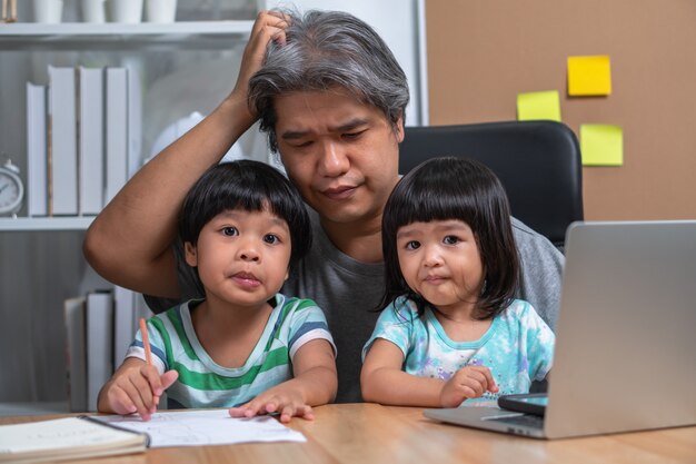 Asian father attempt to work at the home office with a daughter who came into chaos.