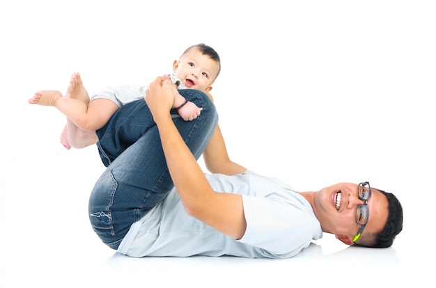 Asian father playing with baby boy