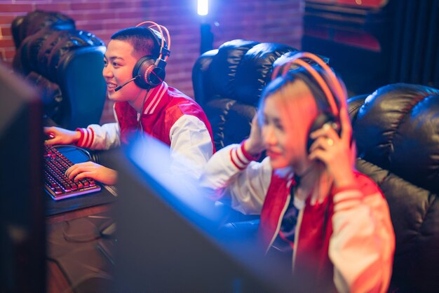 asian female cyber sports team with team during competition