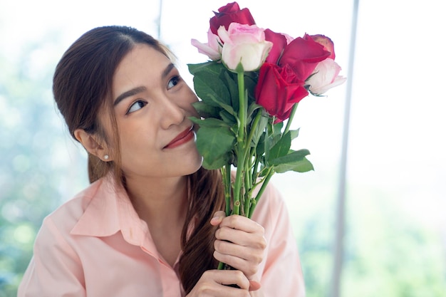 asian female hold flowers