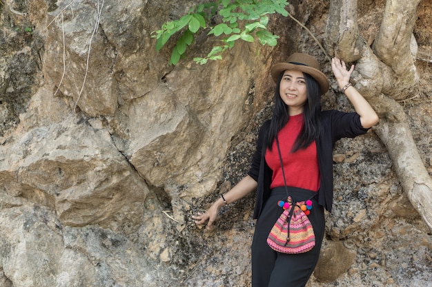 Asian female model poses on the mountain. 