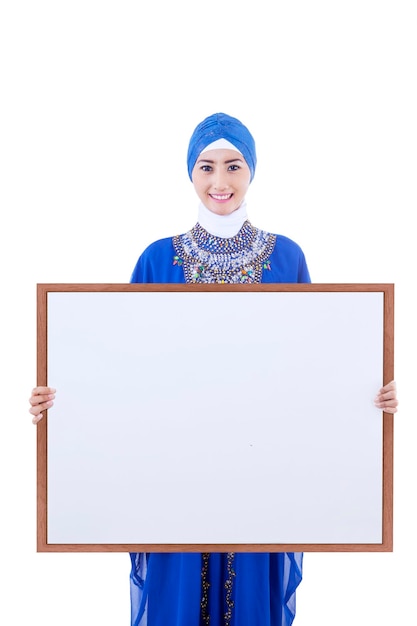 Asian female muslim hold copyspce board isolated