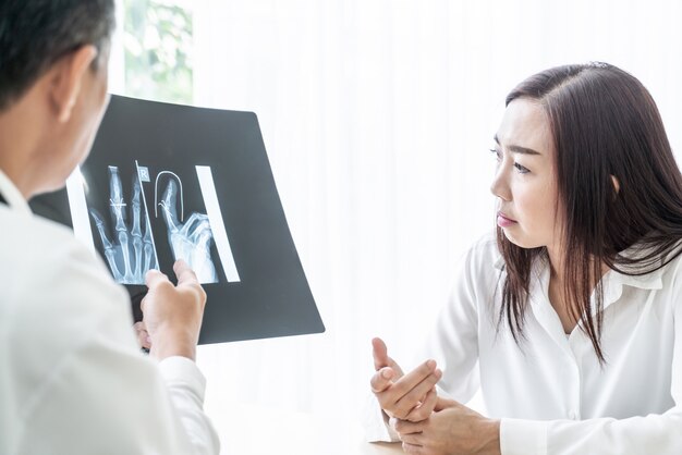 Asian female patient and doctor are discussing