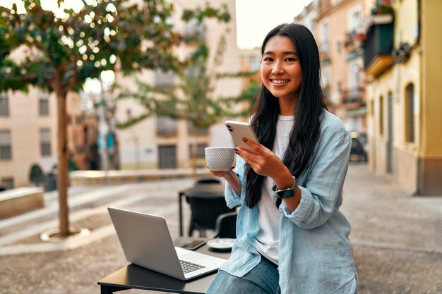 Asian female tourist student on city streets