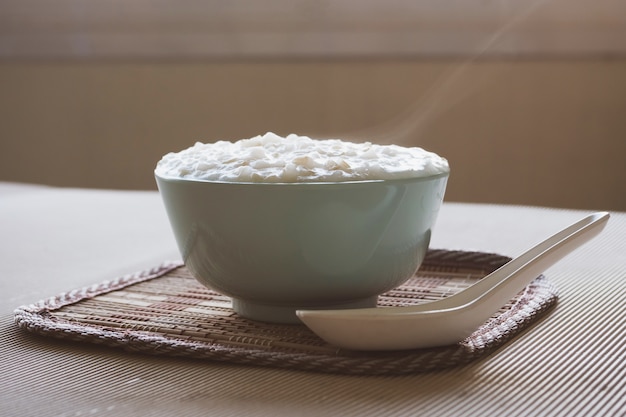 Asian food, Rice porridge in a bowl on the table 