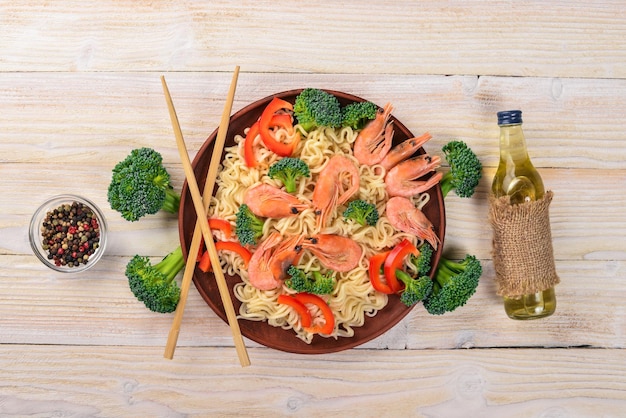 Asian food with seafood and vegetables Shrimp broccoli paprika spices Top view Free space for text