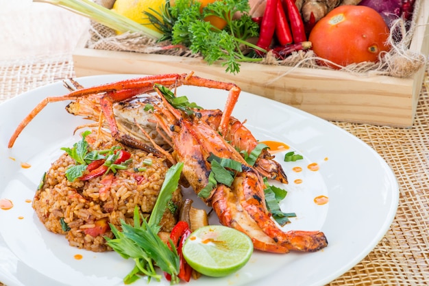 Asian fried rice with chicken, prawns, egg and vegetables, Thai cuisine