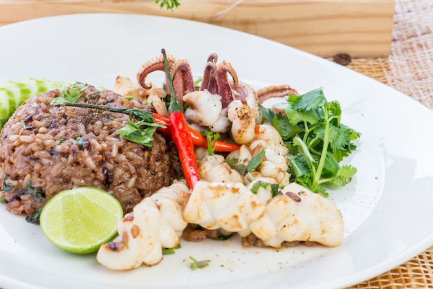 Asian fried rice with chicken, prawns, egg and vegetables, Thai cuisine